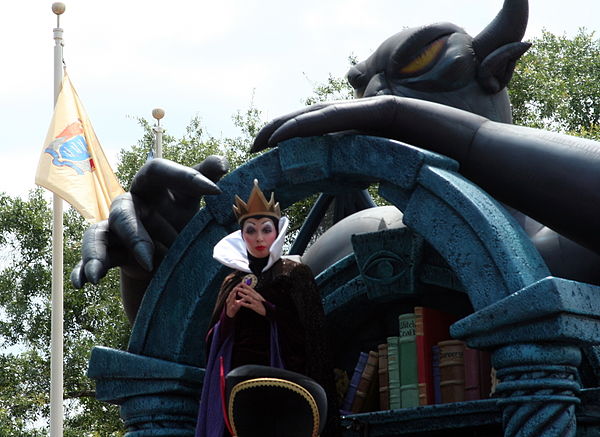 The Queen with her magic books is watched over by the demon Chernabog from Fantasia at Share A Dream Come True Parade 2008