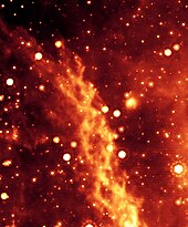 An artificial color image of the Double Helix Nebula, thought to be generated at the galactic center by magnetic torsion 1000 times greater than the Sun's. False-Color Image of Double Helix Nebula.jpg