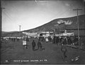 Front Street showing businesses and advertising banners, Dawson, Yukon Territory, 1899 (AL+CA 2710).jpg