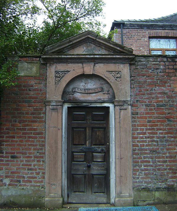 Old entrance gate in a garden wall on the Cliff