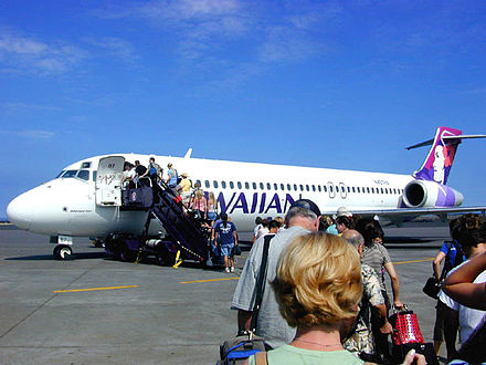 Passengers board a Hawaiian Boeing 717-200 at Kona International Airport for an inter-island flight