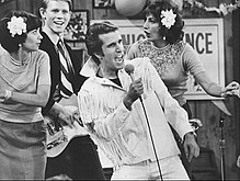 Winkler's character, "The Fonz" (pictured), became a breakout character by the middle of the second season. Happy Days Fonzie Superstar 1976.JPG