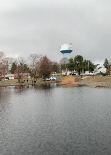 Helmetta Pond section of Manalapan Brook, with the Helmetta water tower in the background