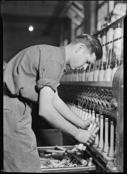 File:High Point, North Carolina - Textiles. Pickett Yarn Mill. Doffer in action - trying to portray doffer personality - NARA - 518518.tif