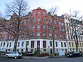 Apartment building in closed development in a corner with a front garden