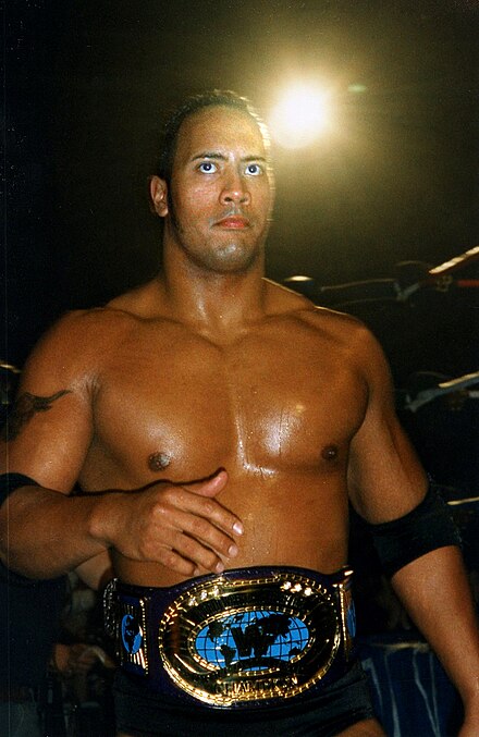 The Rock at Mayhem in Manchester in Manchester, England during one of his two Intercontinental Championship reigns, April 1998