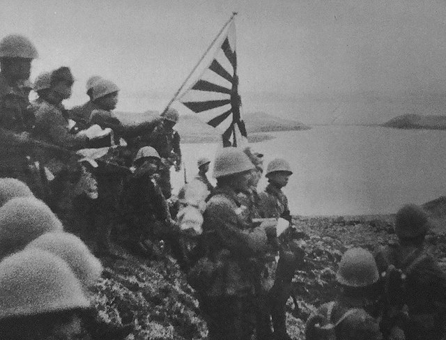 Japanese troops raise the Imperial battle flag on Kiska Island in the Aleutians on June 6, 1942.
