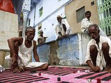 2. Parcheesi, the national game of India, being played at the crossroads, Pushkar, Rajasthan.