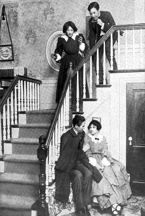 Cromwell (seated) as John Brooke with Alice Brady as Meg in the Broadway production of Little Women (1912)