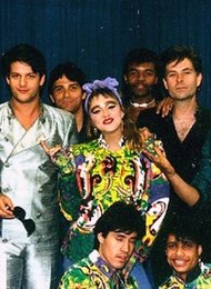 Madonna (pictured) had five songs on the Year-End Hot 100, the most of any artist in 1985. MadonnaVirginTour (cropped).jpg