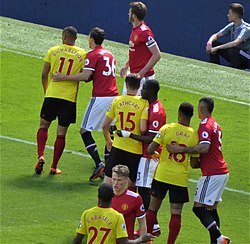 Kabasele being marked by Scott McTominay during a match against Manchester United on 13 May 2018. Manchester United v Watford, 13 May 2018 (20).jpg