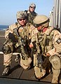 Navy SEALs in a VBSS exercise, armed with CQBRs with standard M4 stocks. They also use LMT sights and PRI Aimpoint rings.