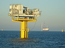 Offshore substation, with jackup ship and wind turbine in background (2006) Offshore-132kv-Substation.jpg