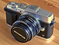 Olympus EP-5, the last of the PEN series cameras made under ownership of the Olympus Corporation before the purchase of the brand by OM Digital Solutions. Olympus PEN E-P5 Front 2.jpg