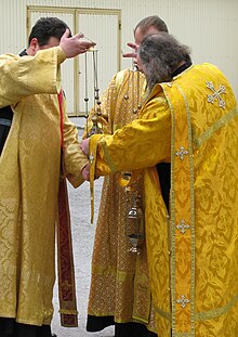 Orthodox deacons preparing incense for a Cross Procession in Novosibirsk, Russia. Orthodox deacons.jpg