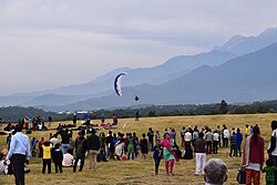 Spectators and a paraglider