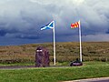 The Flag of Scotland beside the Flag of Northumberland, on the border with England.