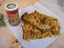 Slices of socca at a Nice market