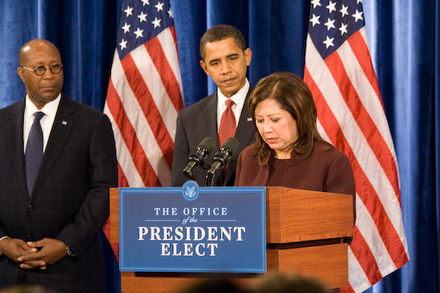 Solis speaks at the announcement of her being chosen as the new Secretary of Labor. President-elect Barack Obama and United States Trade Representative-to-be Ron Kirk look on.