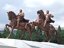 Equestrian statues of younger versions of Kim Jong-il (right) and Kim Il-sung, Pyongyang Statue at Mansudae Art Studio.JPG