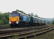 A Stobart Pullman liveried rake of coaches, headed by a DRS liveried Class 47 locomotive number 47712 Pride of Cumbria Stobart Pullman hauled by DRS 47712 photo 2.jpg