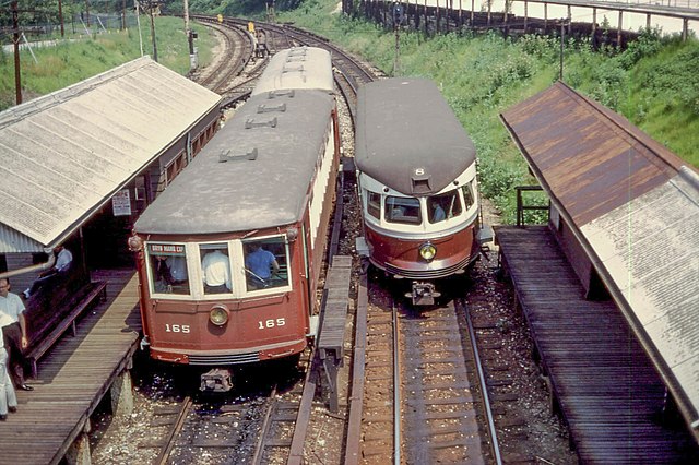 A Brill Bullet (right) passes a pair of "Strafford Cars" (left), Philadelphia, June 1968