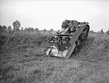 Bren Carrier No.2. The earlier carriers had much less armour than the Universal. In this case only one side behind the driver protected with a sloping plate.