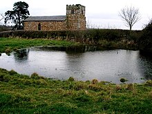 Disused parish church of St Giles at Great Stretton. The pond and the derelict church at Great Stretton - geograph.org.uk - 1580589.jpg