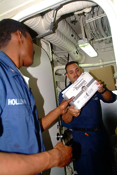 File:US Navy 060218-N-4772B-024 Hospital Corpsman 2nd Class Leonard H. Ray, right, and Hospital Corpsman 3rd Class John K. Holloman inventory diapers and other relief supplies aboard the dock landing ship USS Harpers Ferry (LSD 49).jpg