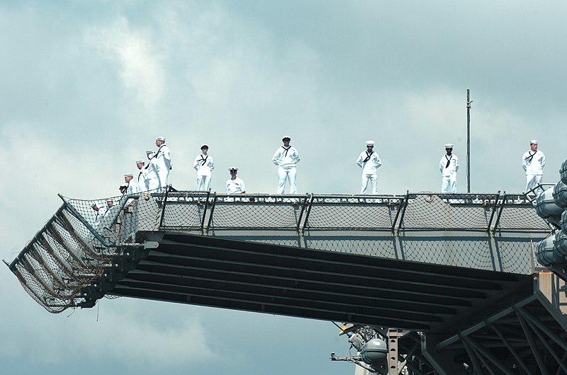 File:US Navy 060606-N-5758H-096 Sailors aboard the amphibious assault ship USS Iwo Jima (LHD 7) man the rails as they depart from Naval Station Norfolk.jpg