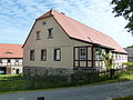 Residential stable house (No. 4) and moving house (No. 4a) as well as the barn of a former Vorwerk