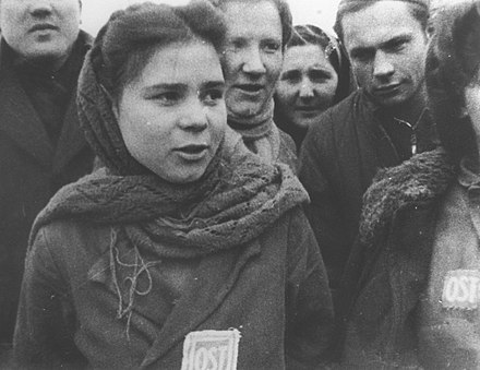 Female forced laborers wearing "OST" (Ost-Arbeiter) badges are liberated from a camp near Lodz, January 1945.