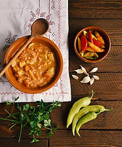 Traditionally served potato soup with peppers and cloves of garlic