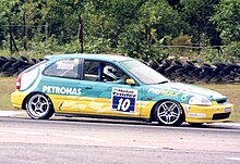 Fariqe Hairuman racing a Petronas sponsored Honda Civic at Batu Tiga Raceway, Shah Alam, Malaysia in 2002. 2002 Fariqe Hairuman.jpg