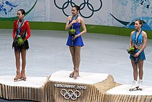 2010 Winter Olympic - Figure skating Ladies podium - Yuna Kim (1st), Mao Asada (2nd), Joannie Rochette (3rd). 2010 Olympic ladies podium.jpg