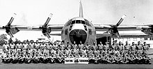 RAAF photo June 1967: No 25 Squadron [Commanding Officer, Squadron Leader C H Mawby (PLT)] in old "summer dress" uniform on annual camp at RAAF Base Darwin (NT) during exercise "High Venus". 25SQNPhotoatRAAFDarwinCampJune1967withC130A Hercules transport aircraft.jpg