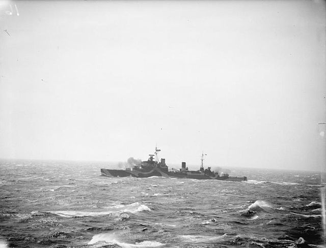 HMS Newfoundland firing her 6-inch guns during target practice, April 1943. Taken from HMS Rodney