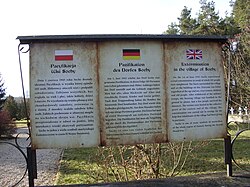 A board informing about the massacre of the village of Sochy on 1 June 1943 by Nazi Germans