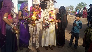 Aadiwasi tribal marriage groom bride.jpg