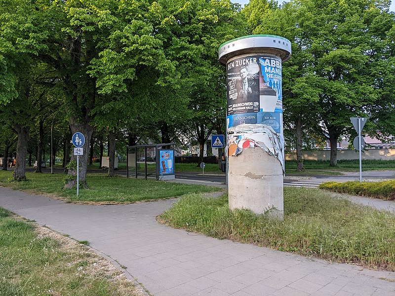 File:Advertising column with torn up posters 2.jpg