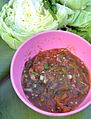 Sapi thong-ueh: a spicy sauce of tomato, fresh chilies, garlic, scallions, coriander/cilantro, and shallot, similar to a salsa cruda