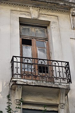 A very small balcony of a very old building in Thessaloniki, Greece.