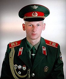 A Western Group of Forces senior sergeant wearing a modified post-Soviet honour guard uniform. Noteworthy changes from the Soviet period include shoulder patches and the "BS
" letters, meaning 'Armed Forces' (Russian: Booruzhionnye sily
) which replaced the "SA
" letters of the Soviet Army. Berlin-soviet.jpg