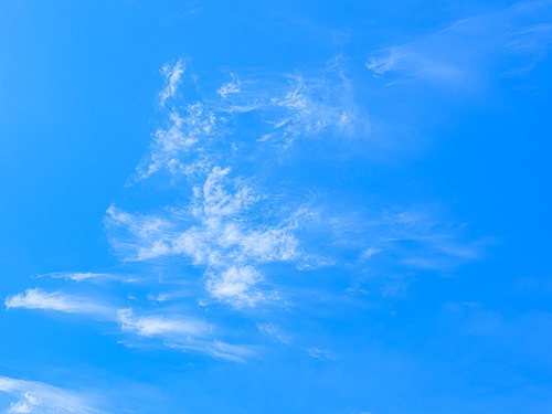 Blue sky with wisps of cirrus cloud