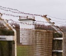 Observation tower of the GDR border troops and part of the original fence. Border facilities 003.jpg