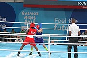 Deutsch: Boxen bei den Olympischen Jugendspielen 2018 Tag 12, 18. Oktober 2018 - Finale Fliegengewicht Mädchen – Martina La Piana (Italien, blau) schlägt Adijat Gbadamosi (Nigeria, rot) 5-0; Ringrichter ist James Beckles (Trinidad und Tobago). English: Boxing at the 2018 Summer Youth Olympics on 18 October 2018 – Girl's flyweight Gold Medal Bout - Martina La Piana (Italy, blue) beats Adijat Gbadamosi (Nigeria, red) 5-0; Referee is James Beckles (Trinidad and Tobago). Español: Boxeo en los Juegos Olímpicos Juveniles de Verano de 2018 en 18 de octubre de 2018 - Combate a medalla de oro de peso mosca para mujeres: Martina La Piana (Italia, azul) le gana a Adijat Gbadamosi (Nigeria, roja) 5-0; El árbitro es James Beckles (Trinidad y Tobago).