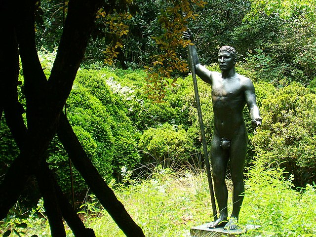 The Huntingtons founded Brookgreen Gardens in South Carolina. This is the setting for Athlete (1915), sculpture by Rudulph Evans.