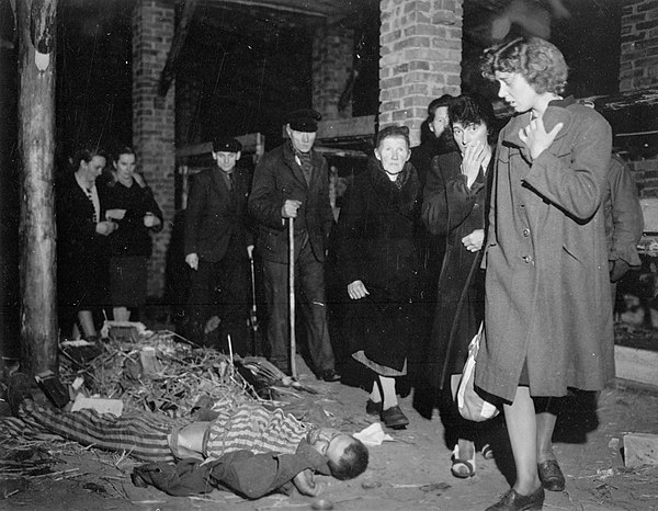 Citizens of Ludwigslust, Germany, inspect a nearby concentration camp under orders of the 82nd Airborne Division