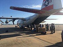 Hurricane Irma disaster relief personnel and 6,000 pounds resupplies are loaded onto an Air Station Clearwater HC-130H Hercules aircraft, September 12, 2017 Coast Guard Air Station Clearwater HC-130 aircrew supports Hurricane Irma relief 170912-G-G0107-1619.jpg