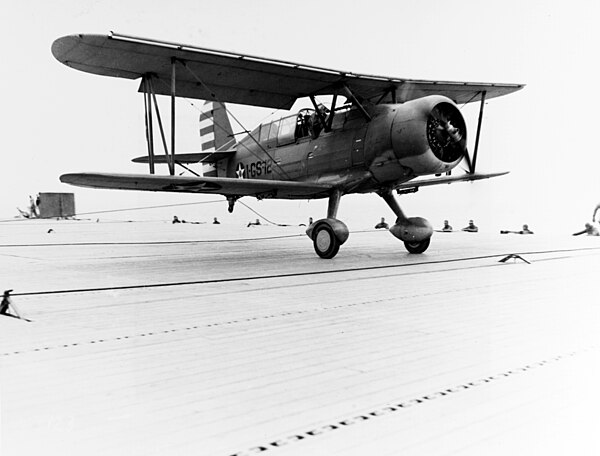 SOC-3A Seagull touches down on USS Long Island in April 1942, celebrating the carrier's 2,000th landing. A Seagull with wheels not floats landing.